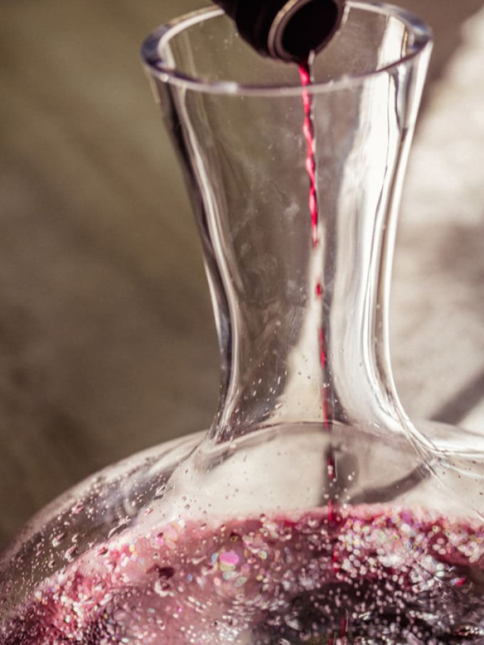 Aerating wine to allow oxygen to work its magic / Getty