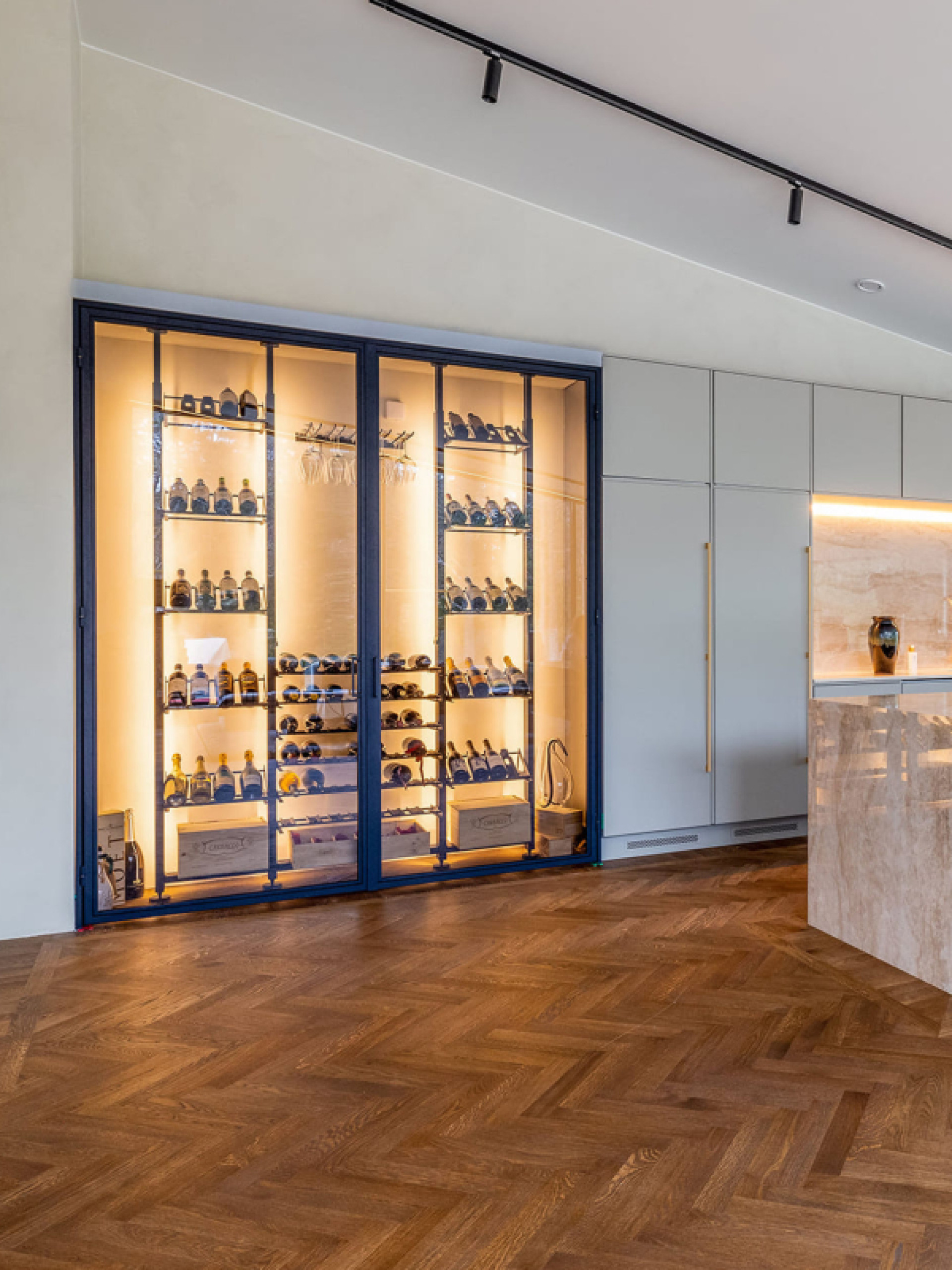 Example of a metal wine storage space embedded in a wall  in a luxury interior in Denmark