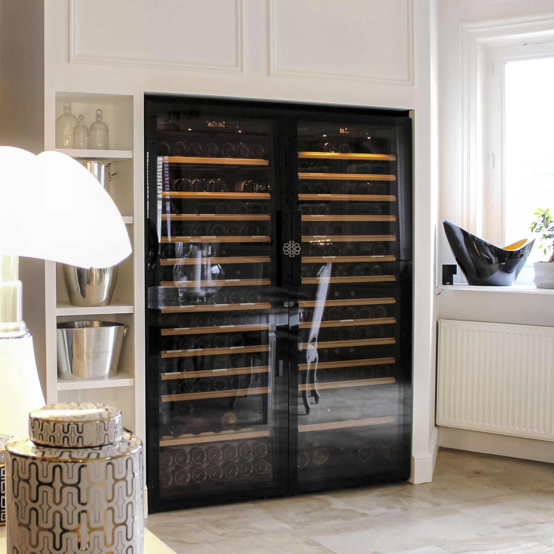 Double wine cabinet built into a wall of a modern bourgeois living room with marble tiling - Pure EuroCave