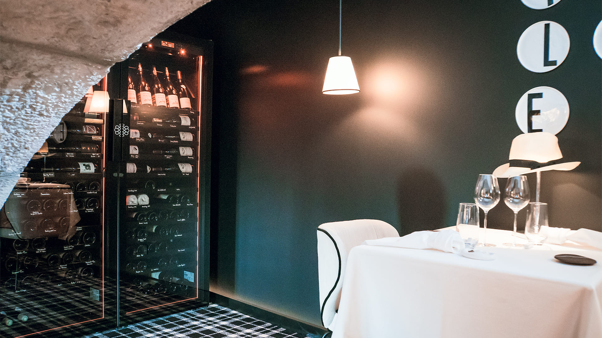 Beautiful installation of 2 wine cabinets in an alcove with arched stone door frame. Perfect integration in the dining area. EuroCave Revelation