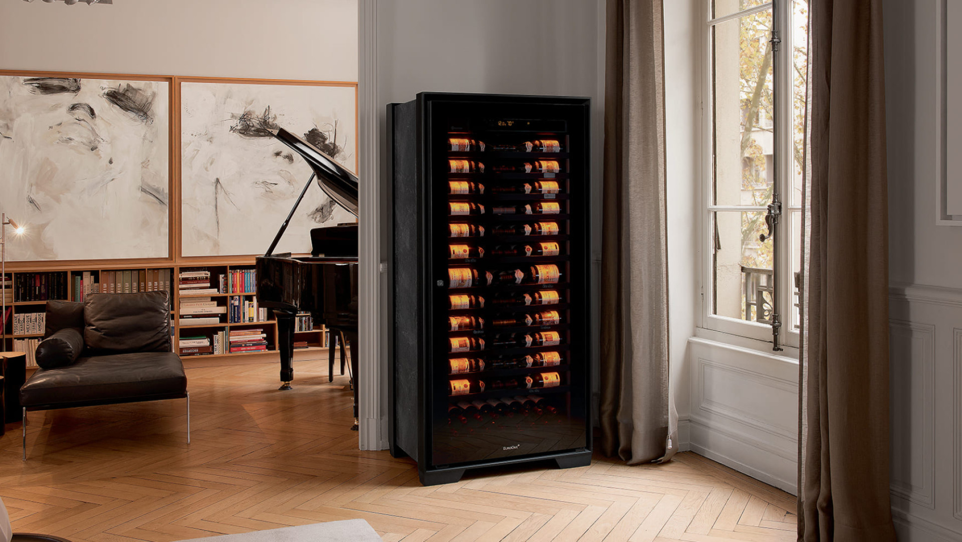 Royale aging wine cabinet installed in a musician’s living room; in the background a grand piano and paintings. – EuroCave Royale aging wine cabinet installed in a musician’s living room; in the background a grand piano and paintings. – EuroCave