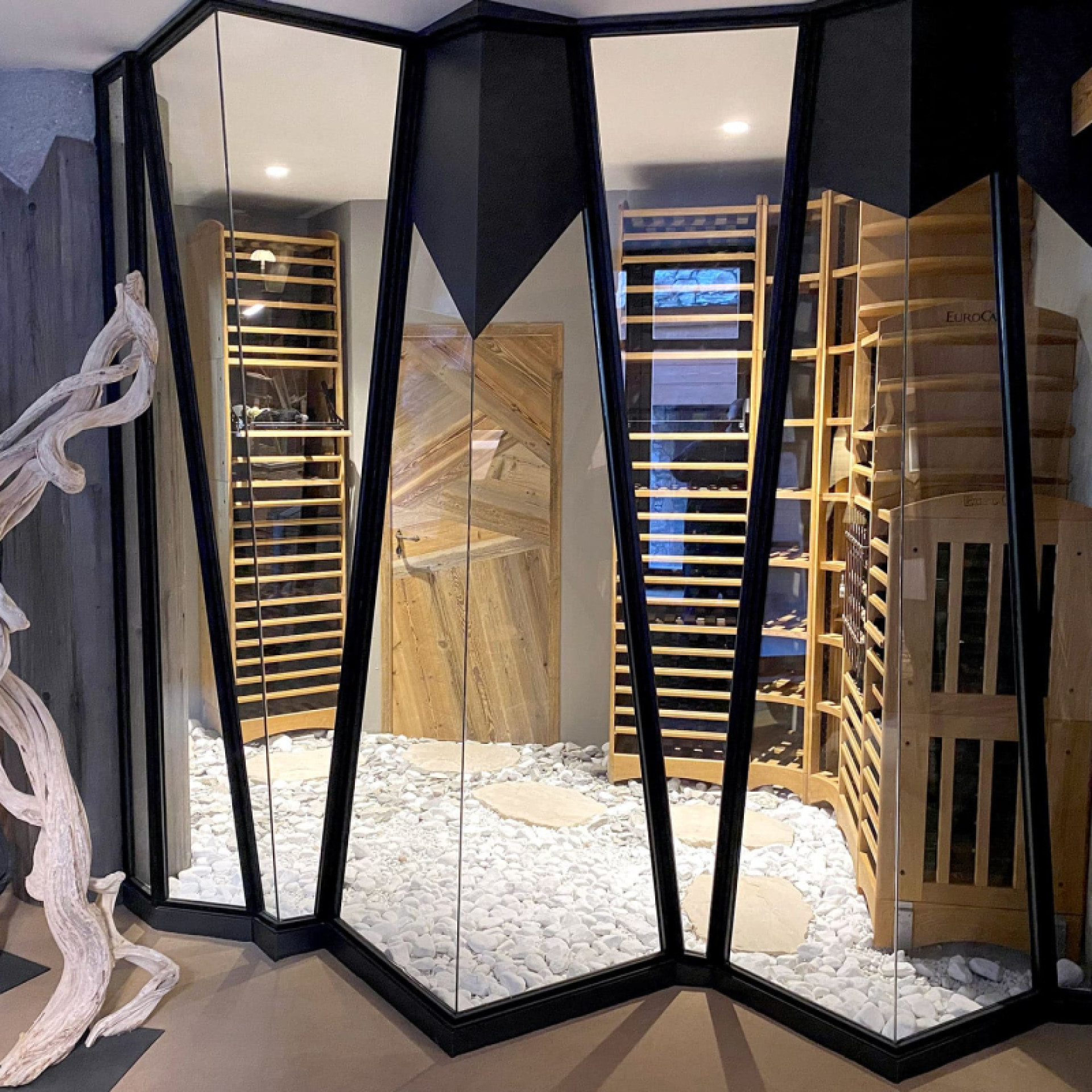 Design of a dream wine cellar combining the tradition and authenticity of French-made solid wood carpenter furniture and the modern design of the air-conditioned room.