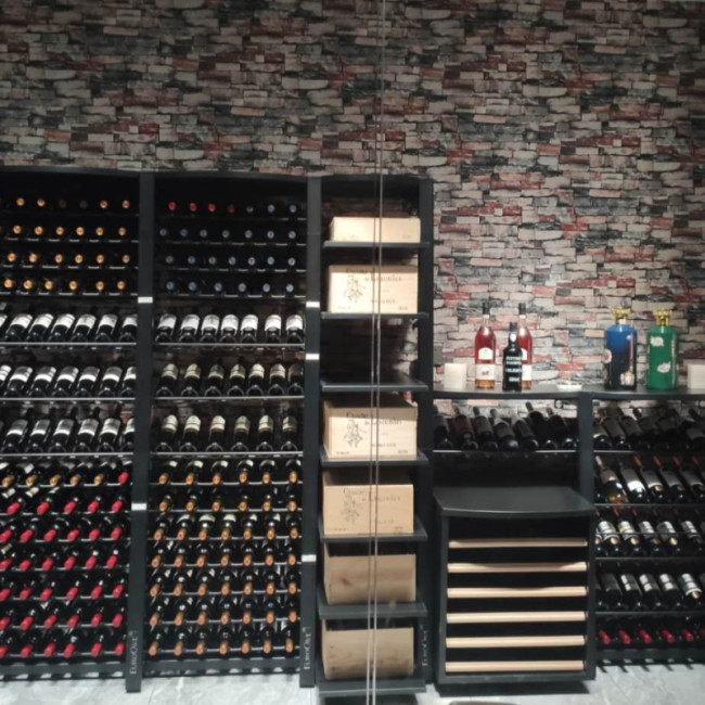 Climate-controlled wine showcase. Modular and functional metal wine cellar storage with sliding racks or wine case options. Individual bottle holders. Climate-controlled wine showcase. Modular and functional metal wine cellar storage with sliding racks or wine case options. Individual bottle holders.