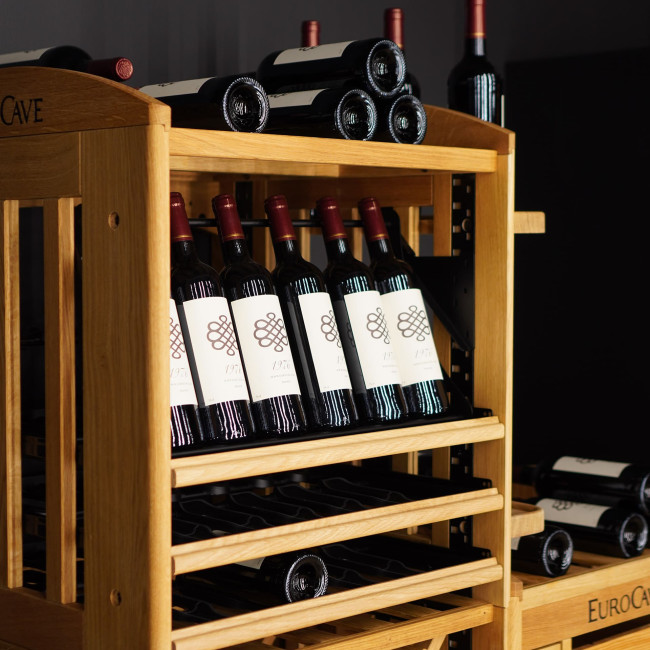 Articulated display on a sliding shelf to showcase wine bottles and make labels easier to see and read. Articulated display on a sliding shelf to showcase wine bottles and make labels easier to see and read.