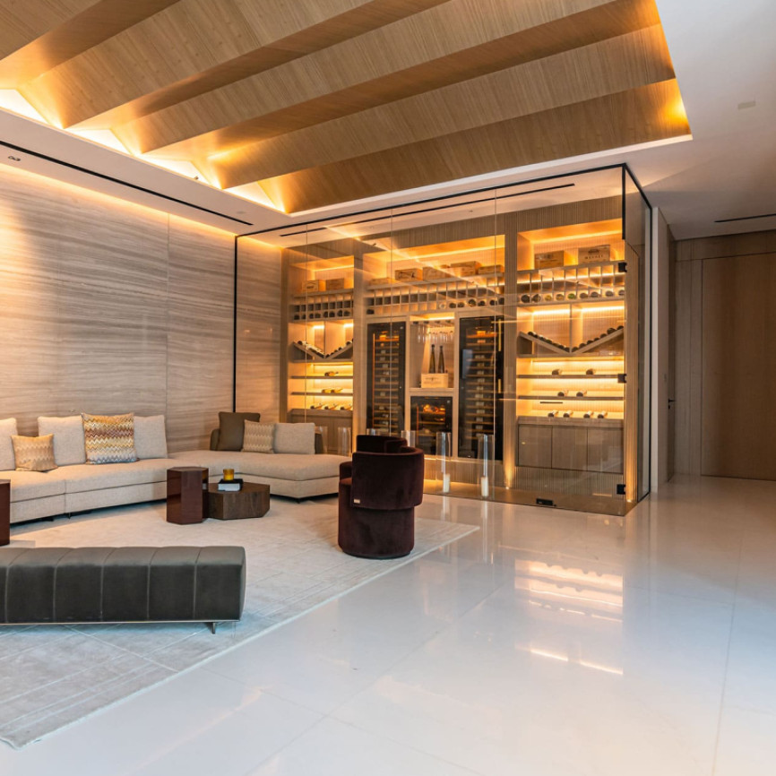 Stunning climate-controlled wine room seamlessly integrated into the interior architecture of a luxury home. Stunning climate-controlled wine room seamlessly integrated into the interior architecture of a luxury home.