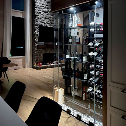 An illuminated wine display case that both delimits esapces and creates a tasting area. An illuminated wine display case that both delimits esapces and creates a tasting area.