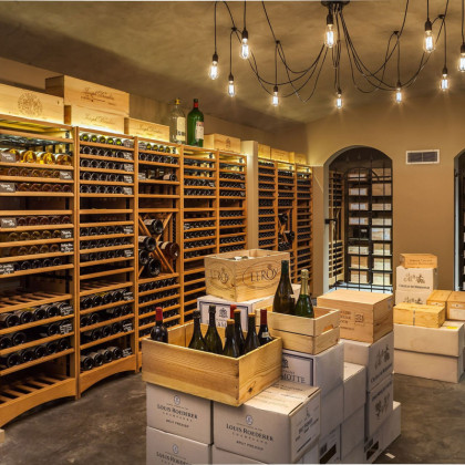 Premium wine cellar layout featuring modular solid wood shelving for professional aging.