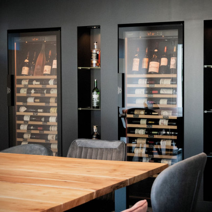 Wine room with EuroCave Revelation wine fridges fitted in custom-made furniture in Annecy, France.