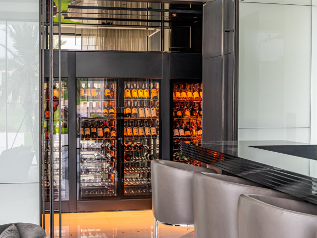 ShowCave EuroCave wine display cabinet in Dubai, bottle presentation with amber lighting