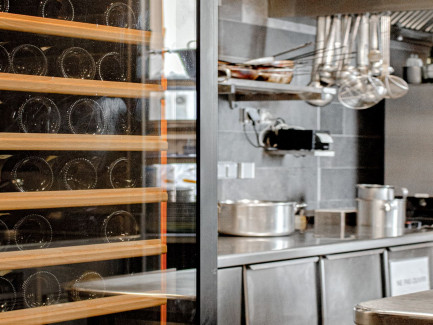EuroCave Pure collection wine cabinet installed in a restaurant service area for wine storage.