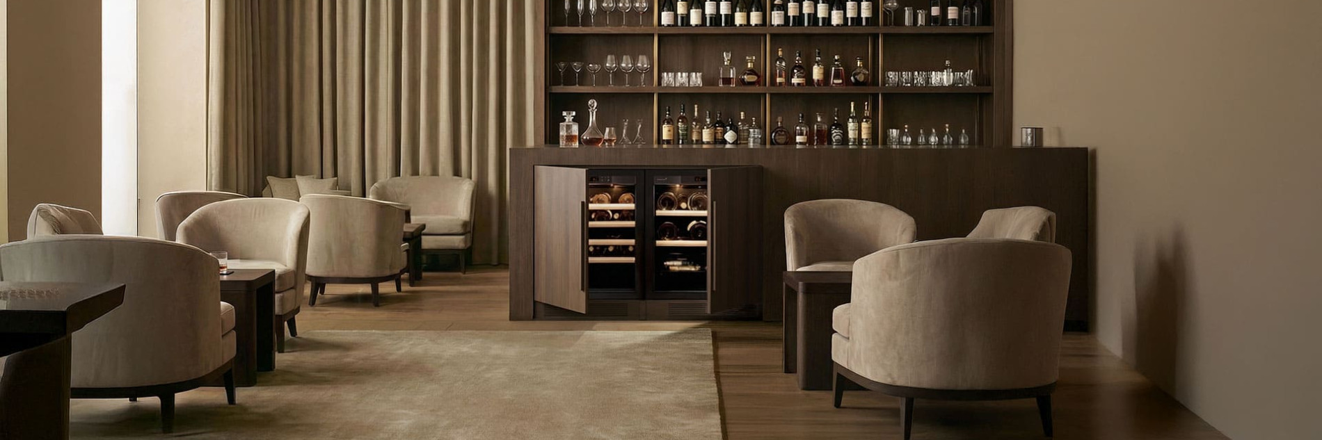 Two side-by-side built-in under-bar wine preservation fridges from the EuroCave Compact range, technical door, muted ambiance.