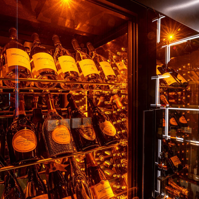 EuroCave refrigerated wine showcase - label-forward display, integrated amber lighting - hospitality sector